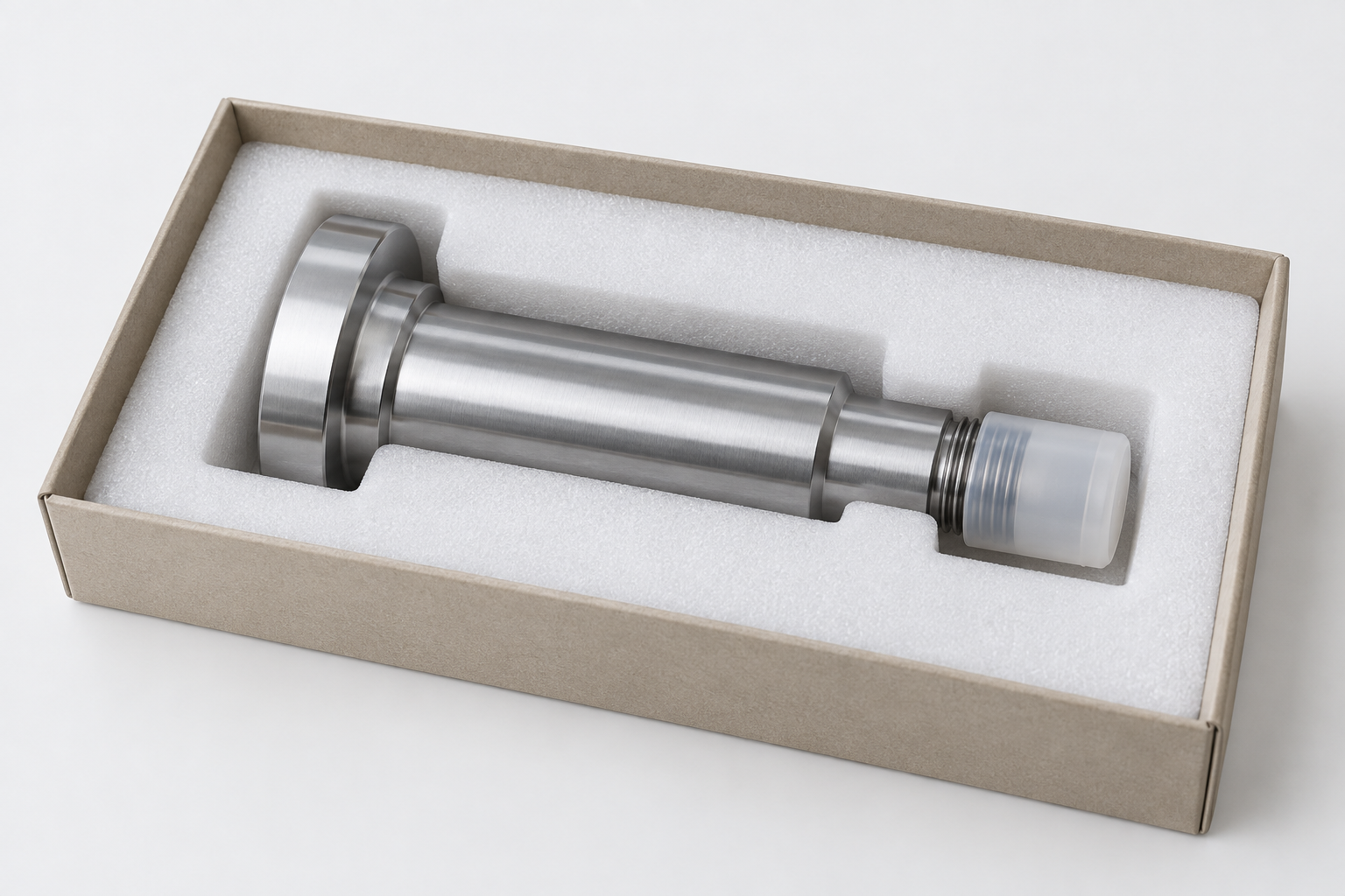 Conceptual machined part supported in a shaped insert with its threaded end protected by a cap