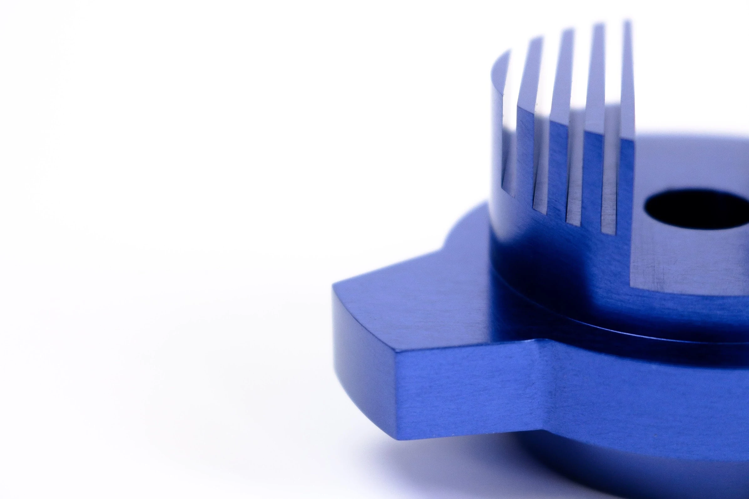Illustrative blue anodized machined aluminum sample